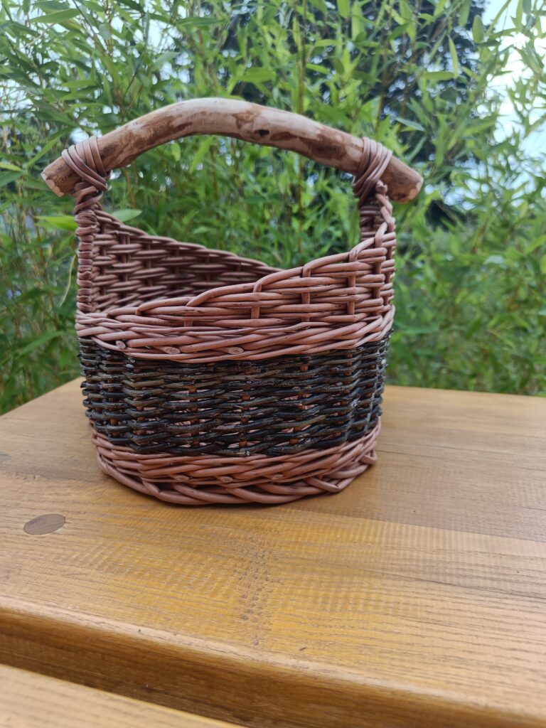 Small rustic basket with natural branch handle